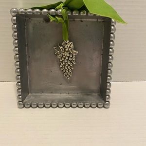 Mudpie Cast Aluminum Napkin Holder. 6” x 6” x 1.5”. Grape trim medal weight.